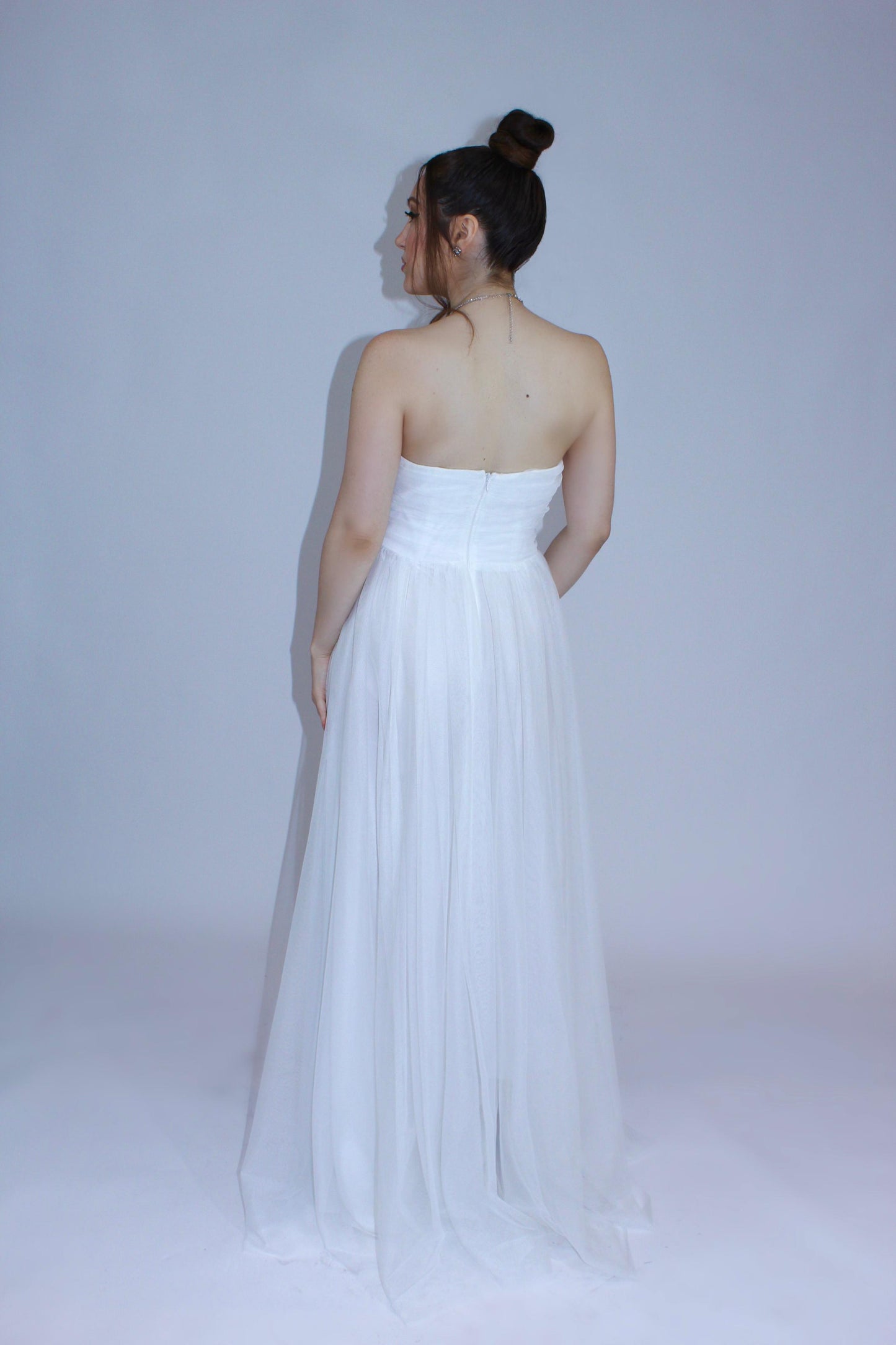 Asymmetrical strapless tulle gown