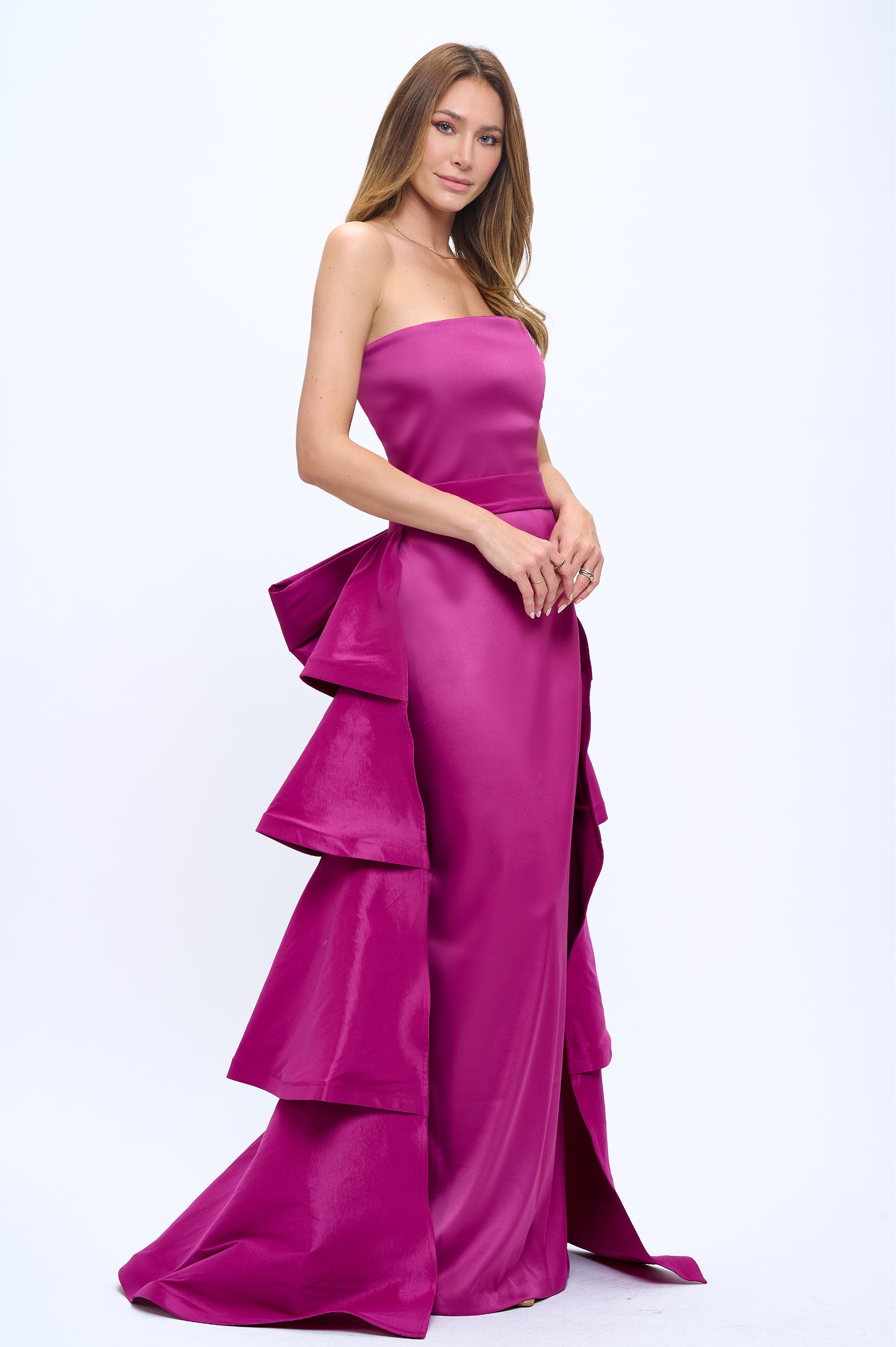 Strapless slit back dress and detachable belted oversized bow ruffle layered train