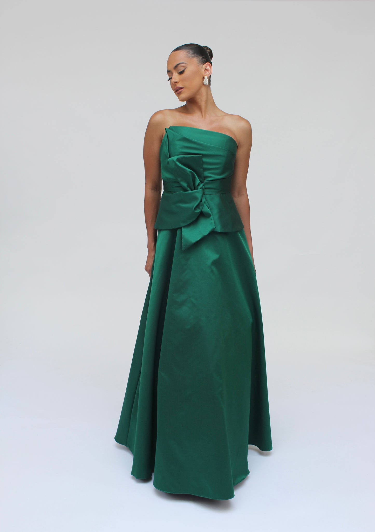 Gia strapless bow taffeta peplum gown