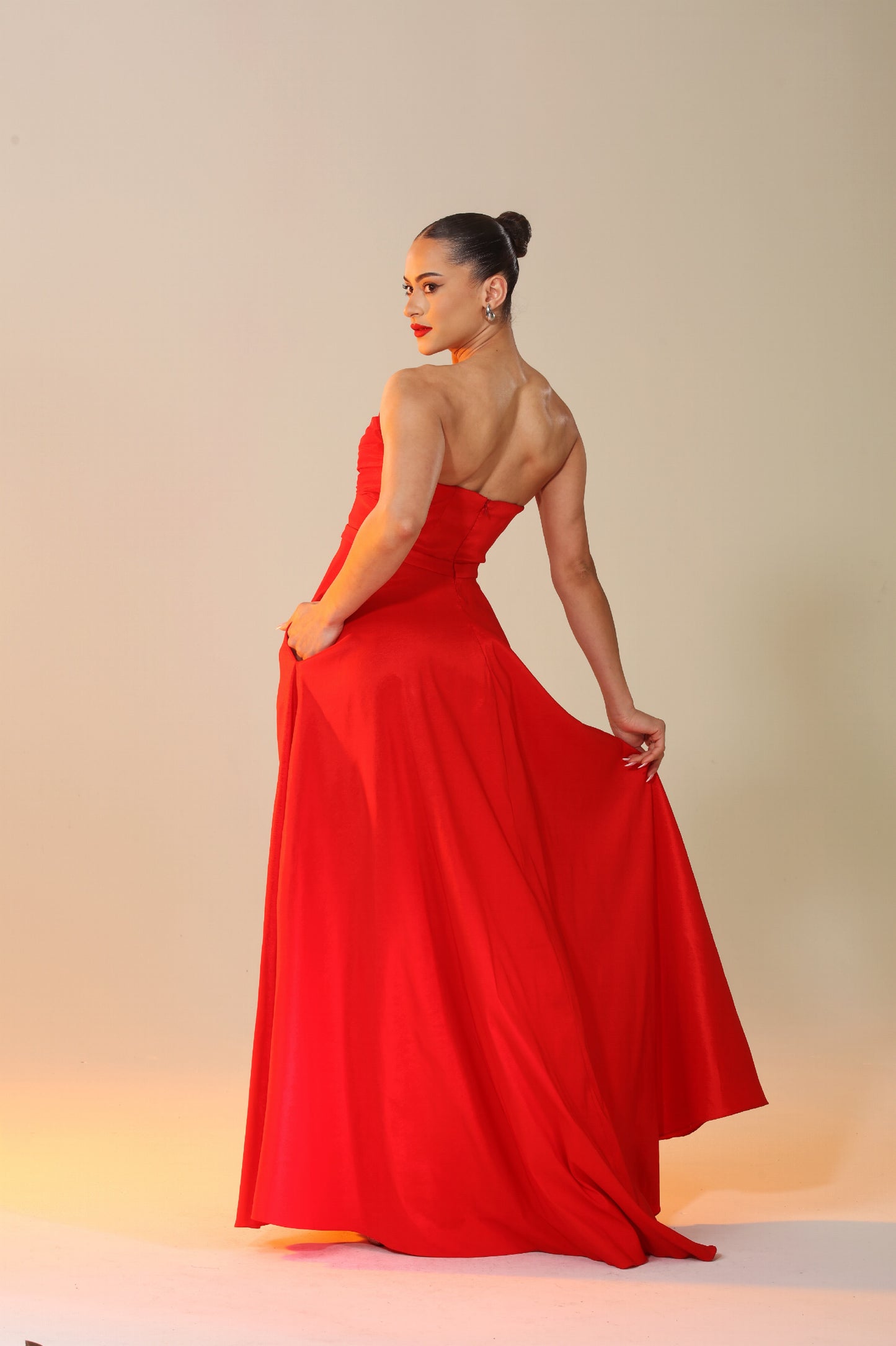 Victoria strapless taffeta knot bodice gown with high side slit and pockets