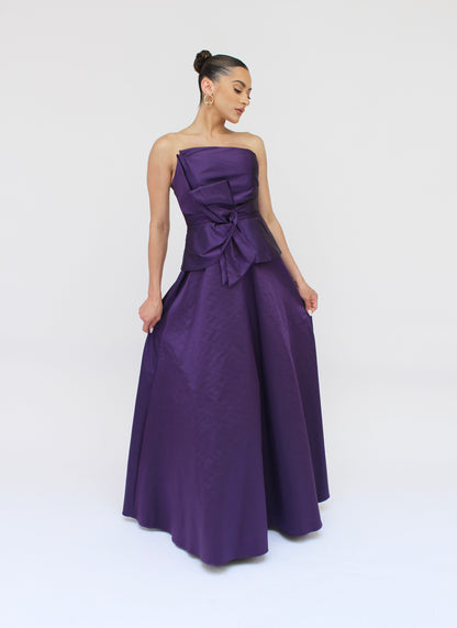 Gia strapless bow taffeta peplum gown