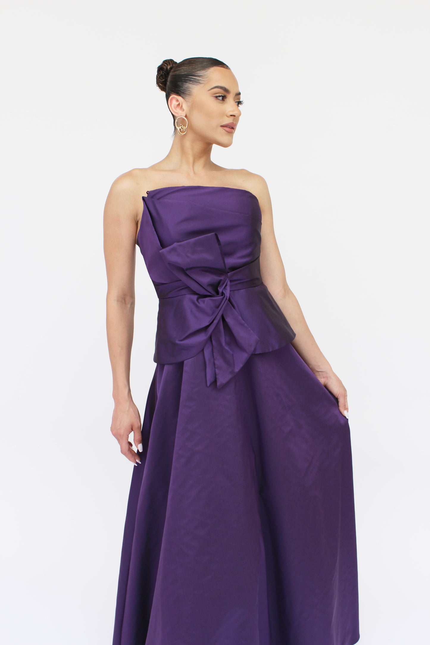 Gia strapless bow taffeta peplum gown