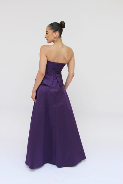 Gia strapless bow taffeta peplum gown