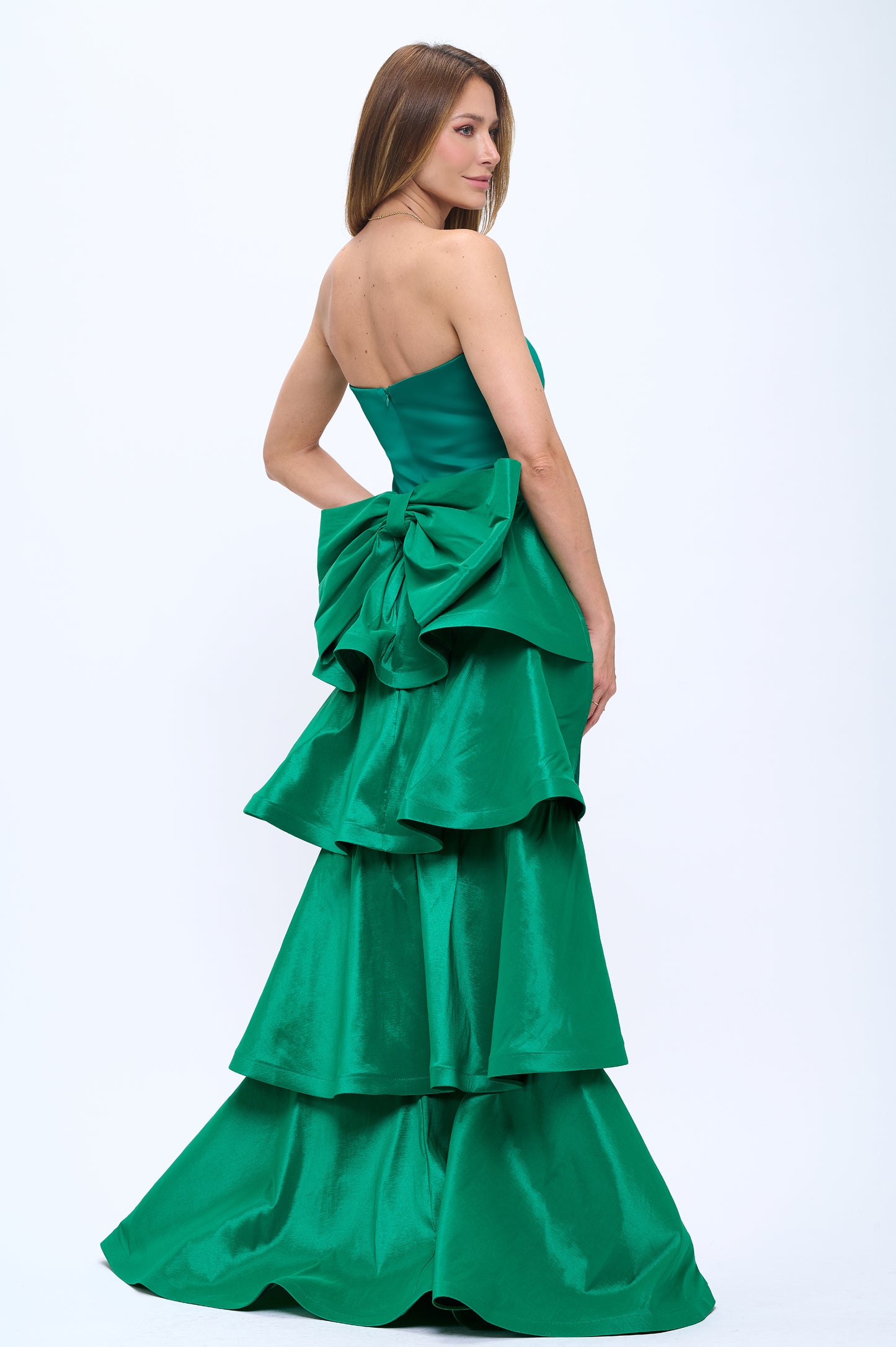 Strapless slit back dress and detachable belted oversized bow ruffle layered train