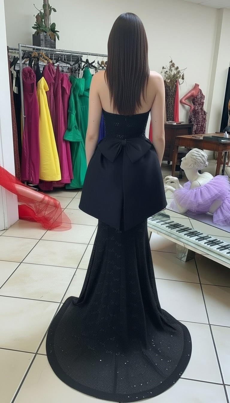 Strapless lace and sequin gown with taffeta  peplum bow detail gown