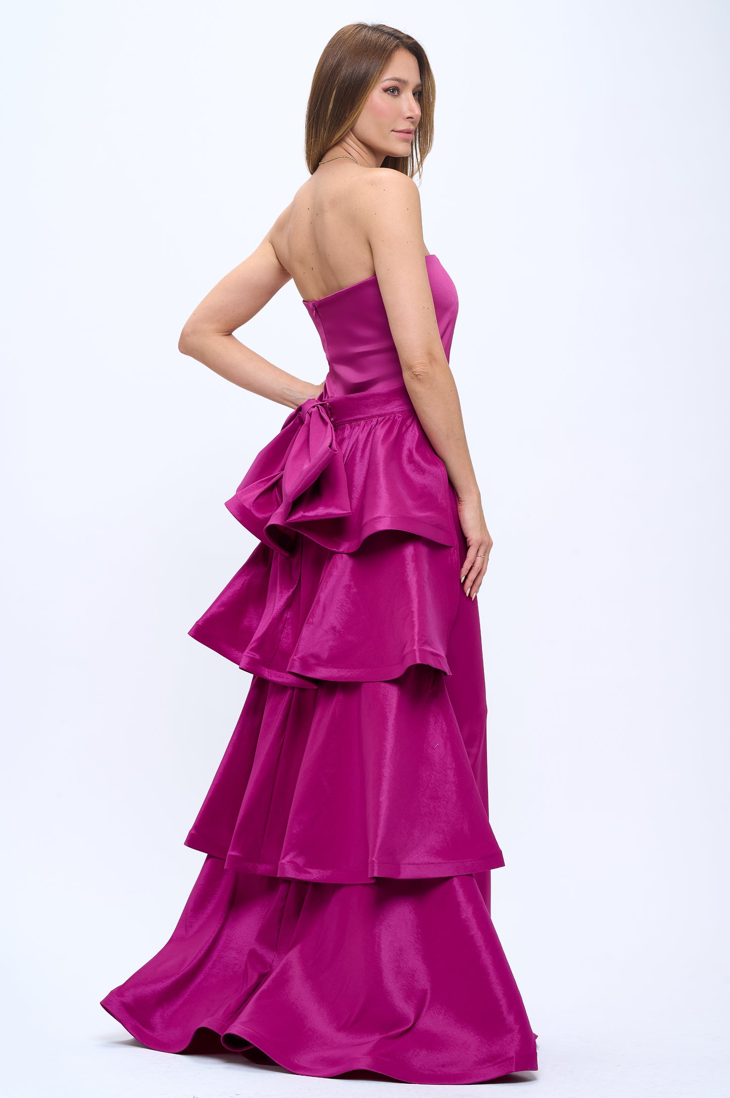 Strapless slit back dress and detachable belted oversized bow ruffle layered train