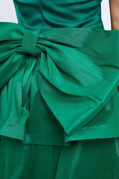 Strapless slit back dress and detachable belted oversized bow ruffle layered train