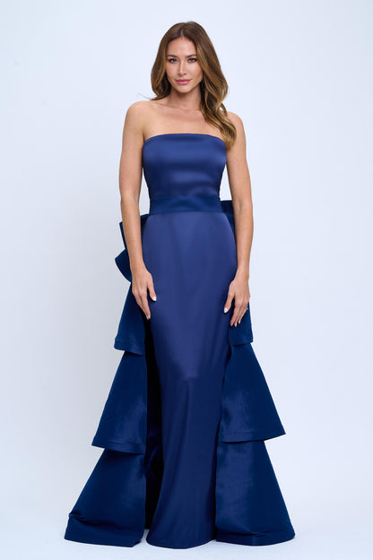 Strapless slit back dress and detachable belted oversized bow ruffle layered train